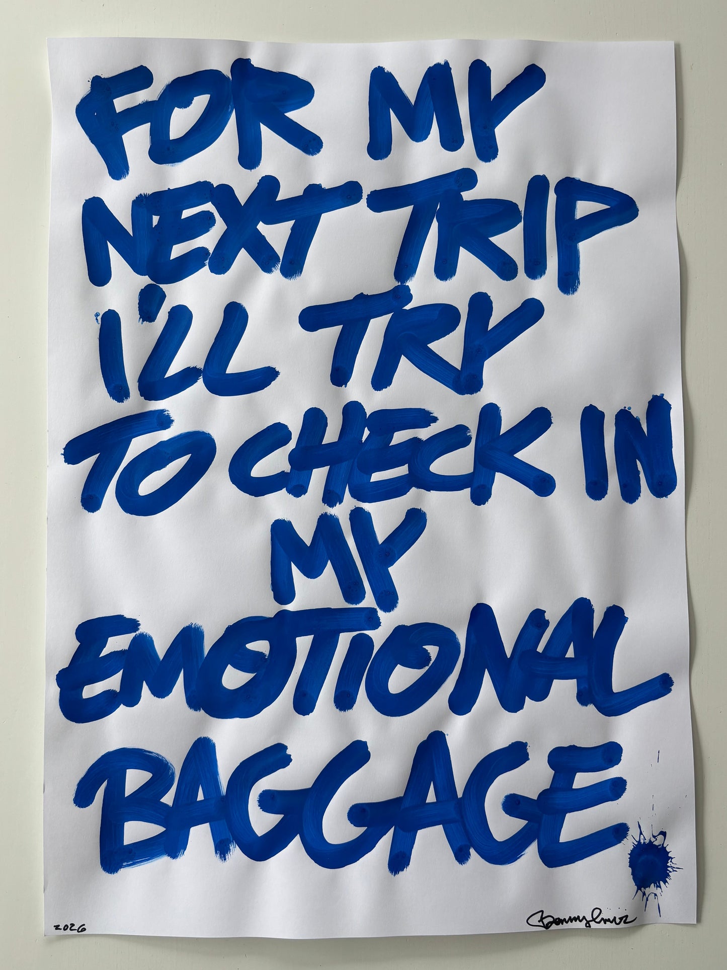 White paper with blue text on a plain background