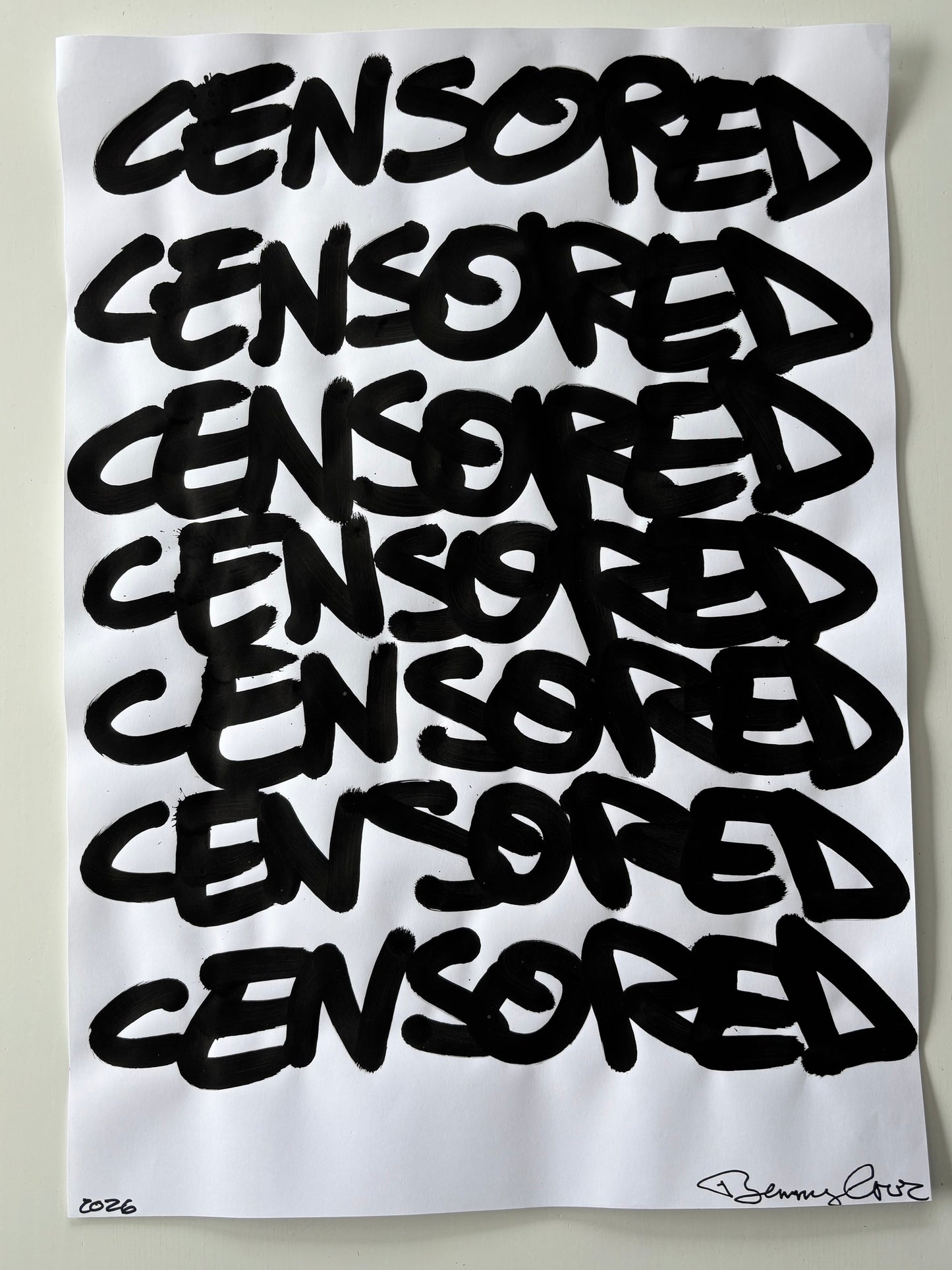 White pillow with black text spelling 'CENSORED' repeatedly